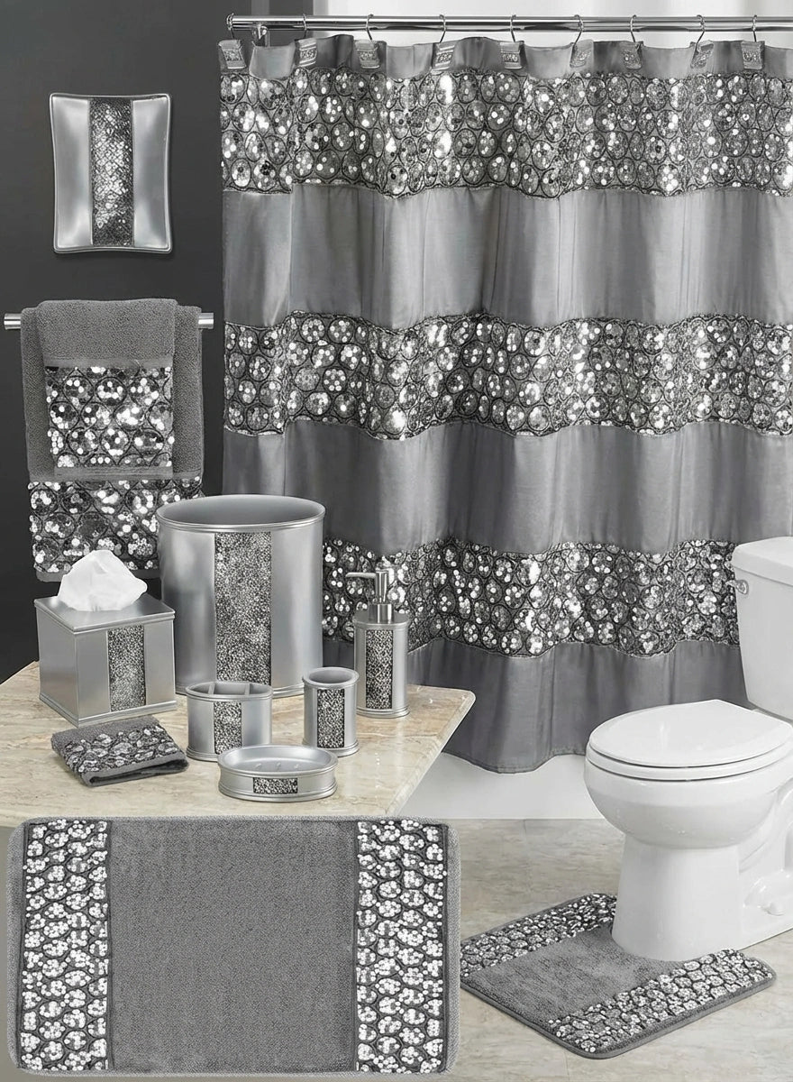 Sinatra Black shower curtain — dramatic black fabric with dazzling silver sequin medallion ring embroidery bands beside black V-chevron mosaic ceramic accessories and black bath rug with sequin border