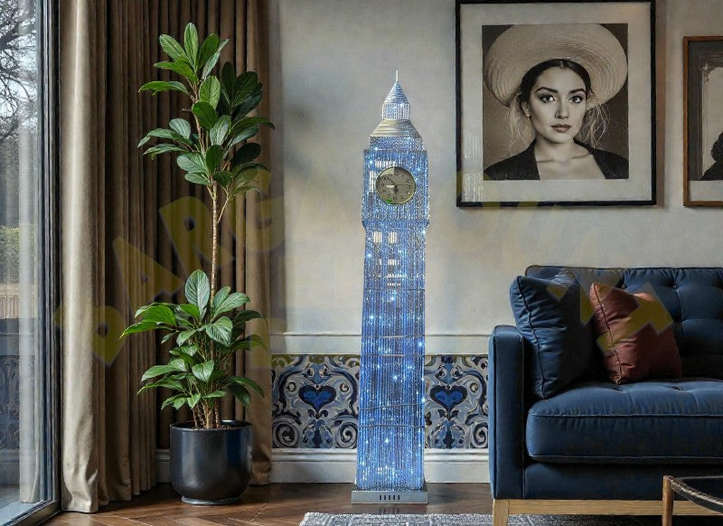 Crystal Big Ben LED Floor Lamp in situ — 65 inch crystal-encrusted clock tower glowing blue-white beside fiddle-leaf fig plant and navy leather sofa in luxury living room with framed portraiture