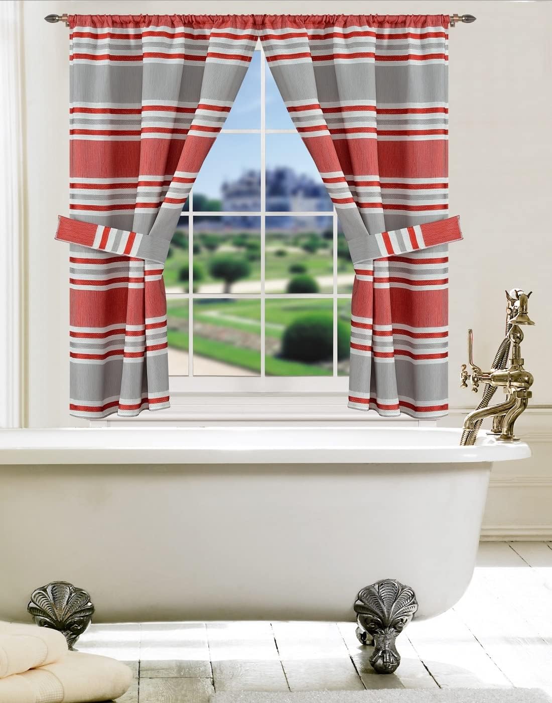 Ivanna Window Curtain Burgundy — bold red and grey horizontal stripe panel with valance and tie-backs at bathroom window above clawfoot tub in warm golden light