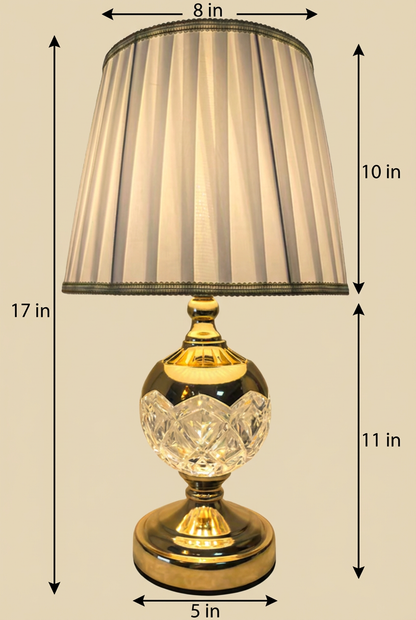 Gold Orb Crystal Table Lamp with dimensions — 27 inch total height with 10 inch ivory pleated shade and 17 inch half-crystal half-gold sphere base, 8 inch shade width and 5 inch base diameter on beige background