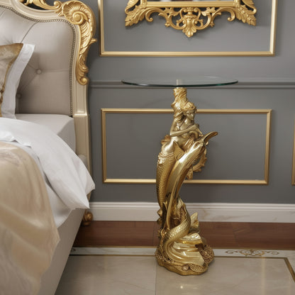 Gold Mermaid Sculptural Glass Side Table lifestyle — 34 inch gold mermaid pedestal table beside gilded baroque upholstered bed in luxury grey and gold bedroom with ornate gold mirror frame on wall