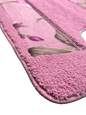 Lily Purple bath rug close-up — rose pink plush pile with lavender orchid blossom print center panel, non-slip backing detail