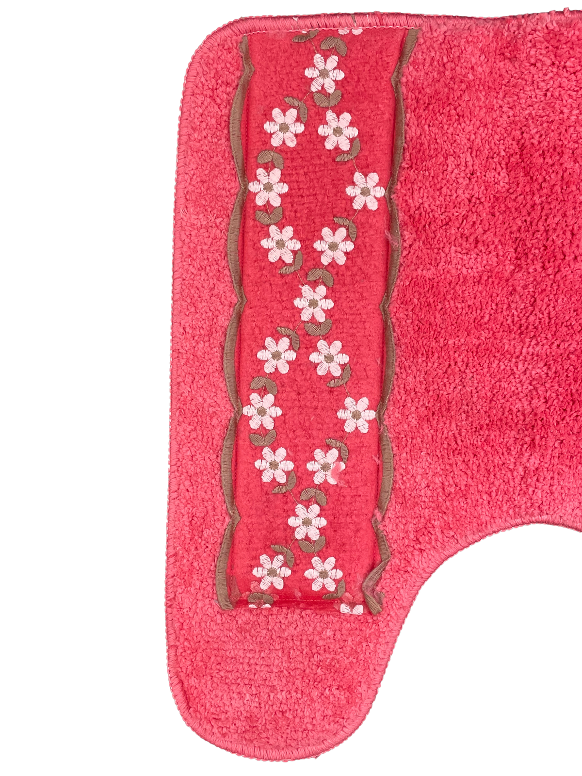 Maya Raspberry contour rug — coral-pink U-shaped toilet surround mat with white embroidered daisy garland border panel closeup on white background