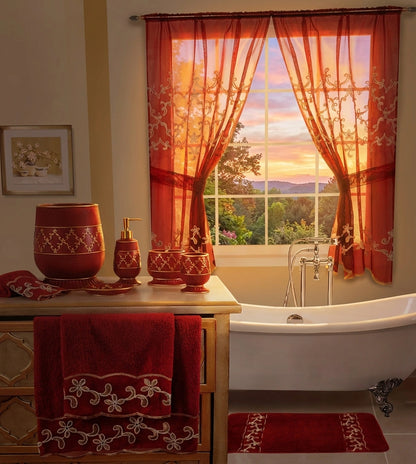 Cassandra Red shower curtain — deep crimson with gold trellis embroidery and layered valance, styled in bathroom with clawfoot tub and sunset view
