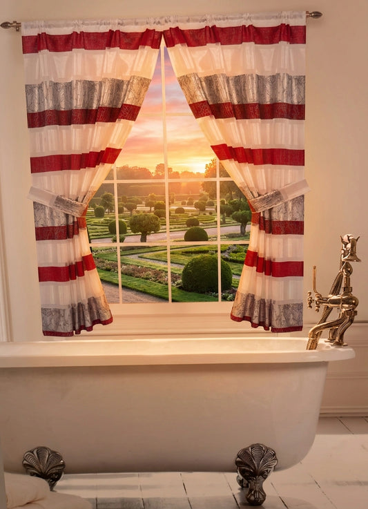 Venezia Red window curtain — crimson red and silver bamboo stripe panel with tie-backs framing garden sunset view over clawfoot tub