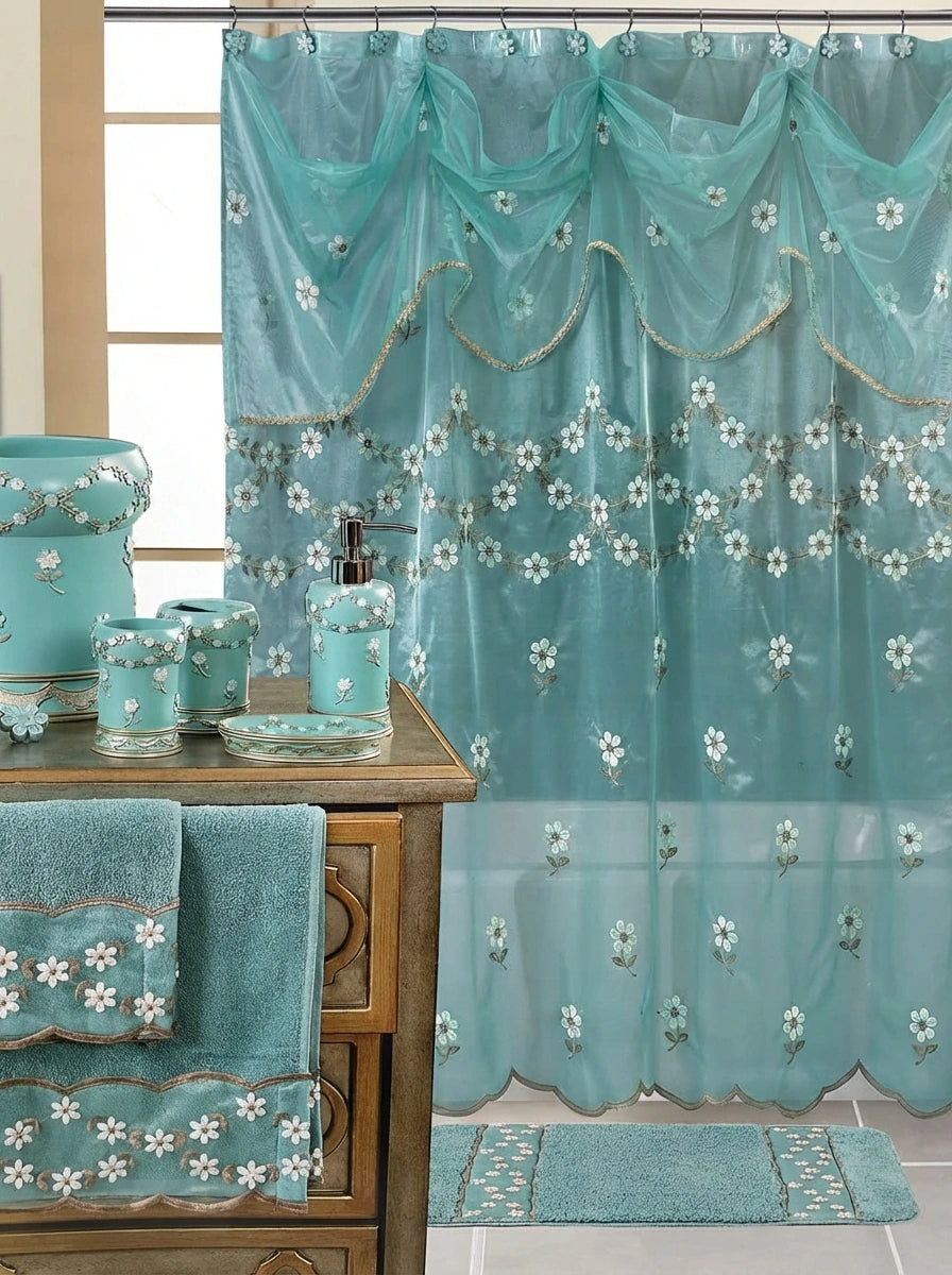 Maya Raspberry shower curtain — rich coral-pink sheer panel with white embroidered daisy garlands and dramatic swag valance with coordinating ceramic accessories and towels