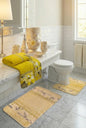 Melrose Grey full bathroom — grey rugs and contour mat with white botanical floral border beside silver ceramic accessories and grey towels in marble bathroom