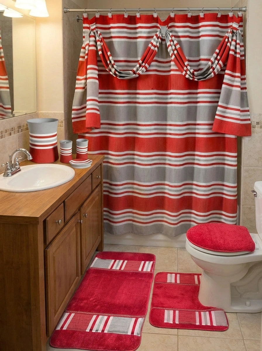 Ivanna Shower Curtain Burgundy — full bathroom view with red-grey stripe curtain, matching rugs and accessories on vanity in warm light