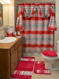 Ivanna Shower Curtain Burgundy — full bathroom view with red-grey stripe curtain, matching rugs and accessories on vanity in warm light