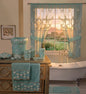 Maya Aqua shower curtain — soft teal sheer panel with white embroidered floral garland chains and swag valance with aqua ceramic accessories and towels on wooden dresser